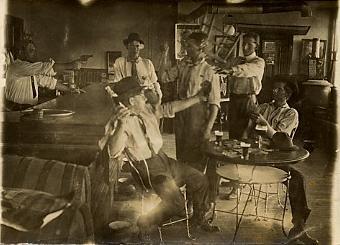 historical photo gun behind bar saloon