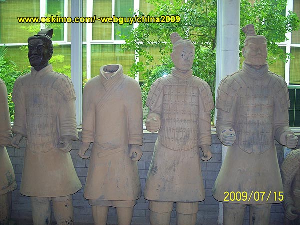 [Four Clay Statues]