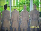 [Four Clay Statues]