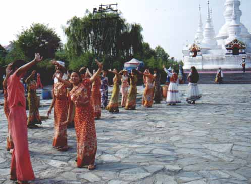 [Dancers in a circle]